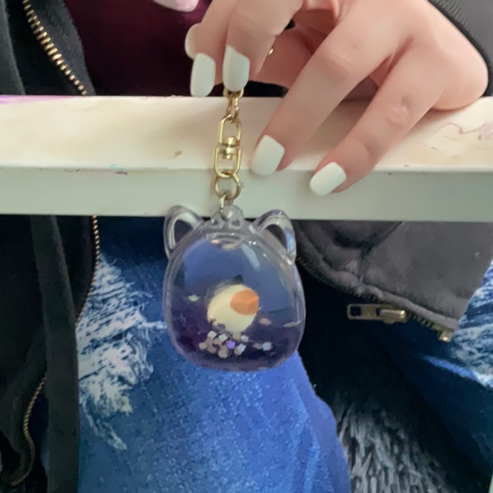 This is a squish, mellow keychain, purple like jelly inside
